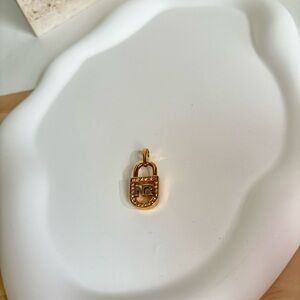 Authentic vintage Nina Ricci gold tone pendant with stone